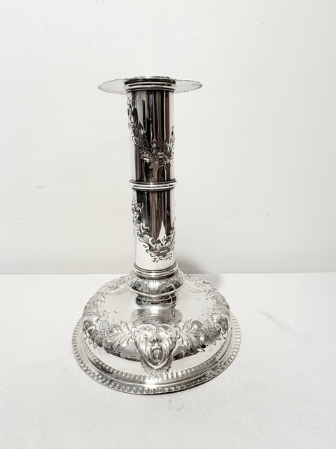 Substantial antique silver plated single candlestick decorated with an open mouthed figure (c.1880)