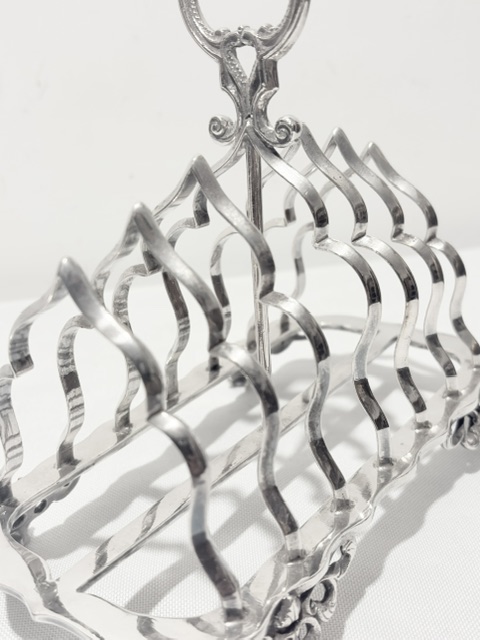Antique Silver Plated Toast Rack with Central Ornate Handle Antique Silver Plated Toast Rack with Central Ornate Handle